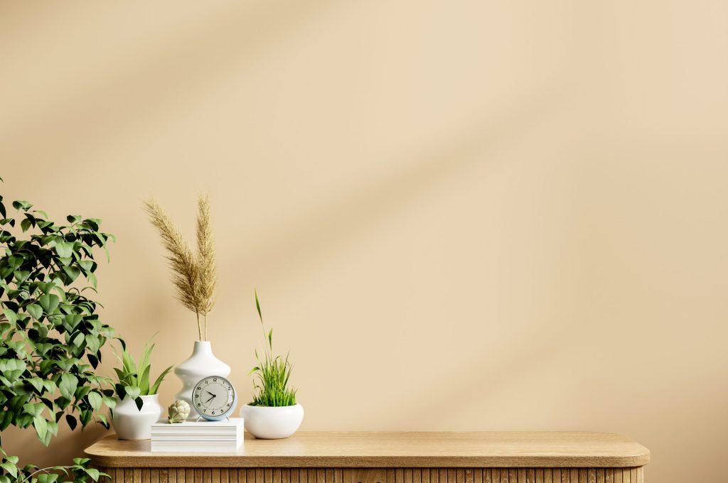 Interior cream color wall mockup with green plant.3D rendering
